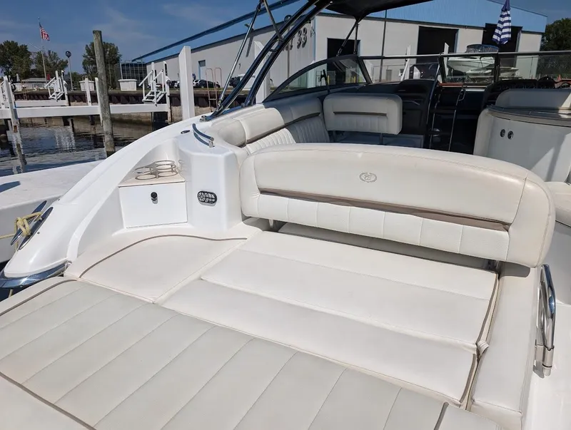 Slide: The Image of 2007 Cobalt 323 boat with white leather seating, docked at marina. - 46