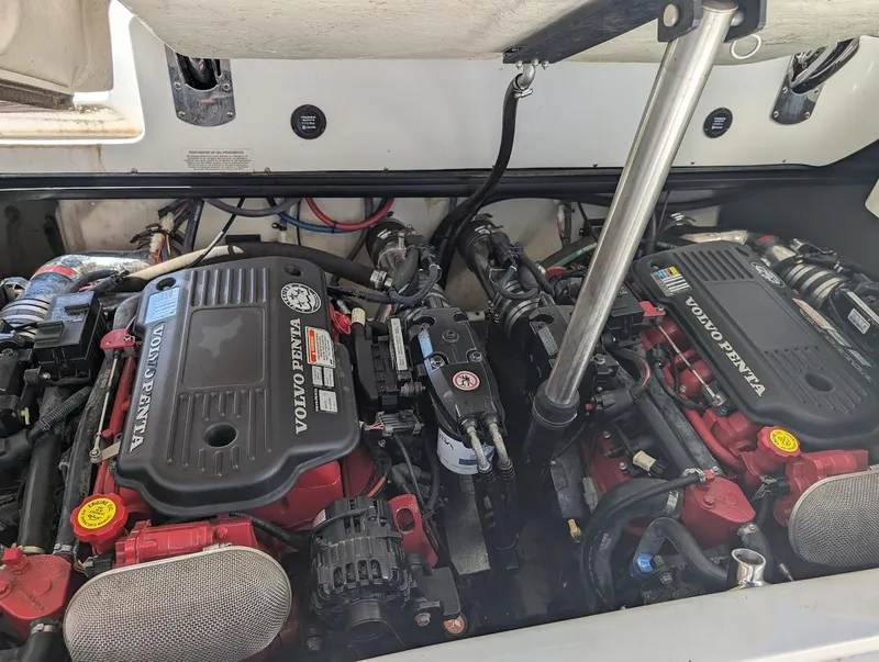 Slide: The Image of 2007 Cobalt 323 boat engine compartment with dual Volvo Penta engines. - 48