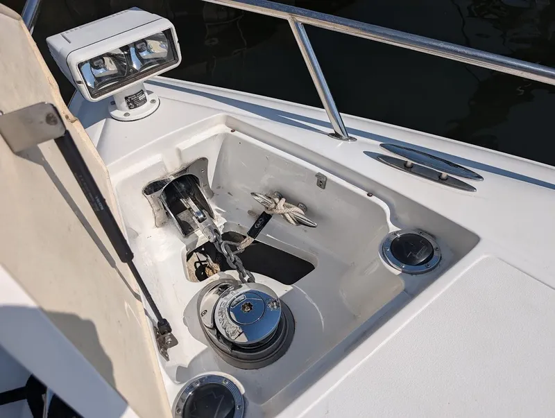 Slide: The Image of Anchor compartment of 2007 Cobalt 323 boat with winch and spotlight. - 6
