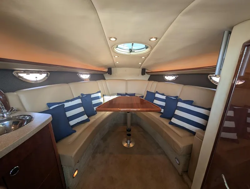 Slide: The Image of Luxurious 2007 Cobalt 323 yacht interior with plush seating and striped cushions. - 8