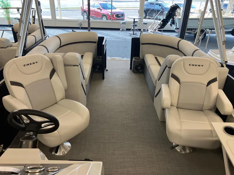 Slide: The Image of 2024 Crest 220 SLC pontoon boat interior with plush seating and modern design. - 6