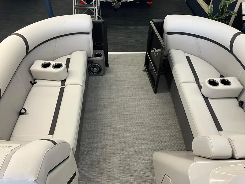 Slide: The Image of 2024 Crest 220 SLC boat interior with sleek gray seating and cup holders. - 5