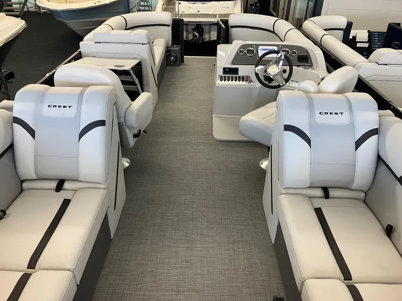 Slide: The Image of 2024 Crest 220 SLC boat interior with luxurious seating and modern dashboard. - 3