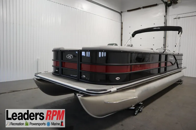 The Image of 2025 Bentley Pontoons 240 CRUISE in showroom, sleek design with black and red accents. - 1