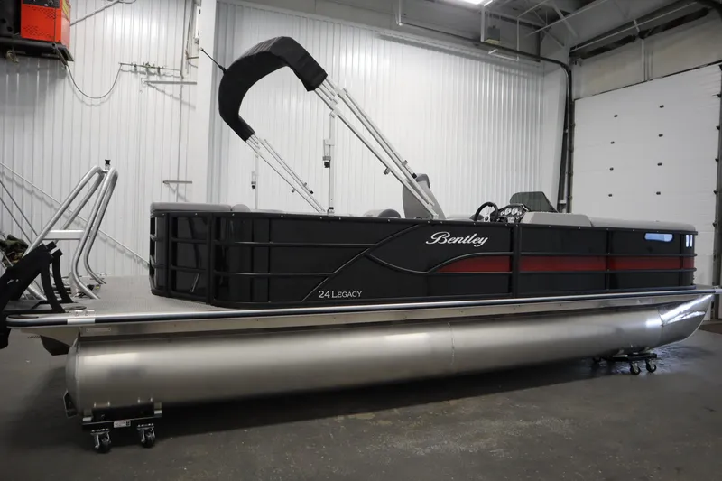 Slide: The Image of 2025 Bentley Pontoons 240 CRUISE in a showroom, rear view. - 2