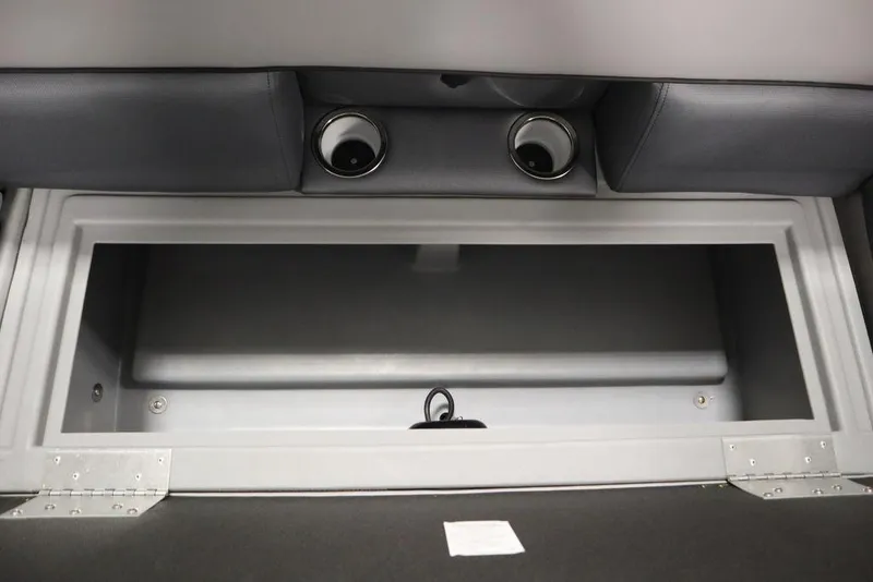 Slide: The Image of 2025 Bentley Pontoons 240 CRUISE storage compartment with cup holders and sleek design. - 21