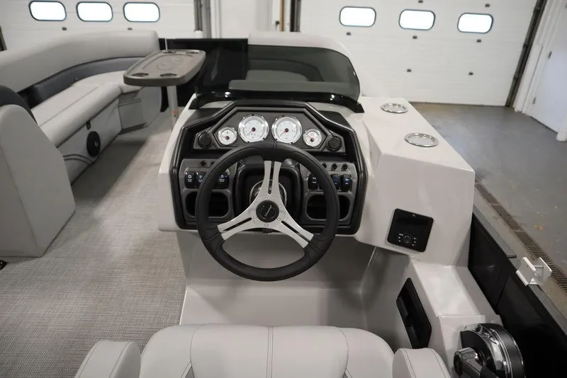Slide: The Image of 2025 Bentley Pontoons 240 CRUISE interior with modern steering and dashboard controls. - 22