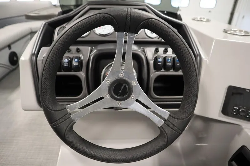Slide: The Image of Steering wheel of 2025 Bentley Pontoons 240 CRUISE, showcasing dashboard controls and modern design. - 24
