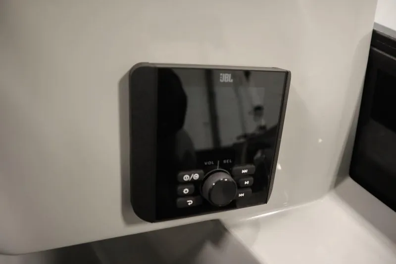 Slide: The Image of JBL audio control panel on 2025 Bentley Pontoons 240 CRUISE boat dashboard. - 25