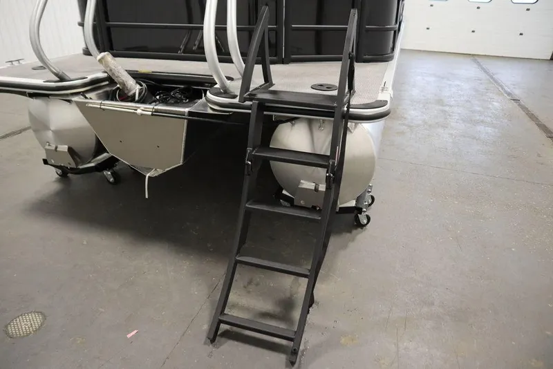 Slide: The Image of 2025 Bentley Pontoons 240 CRUISE with boarding ladder in a garage setting. - 39