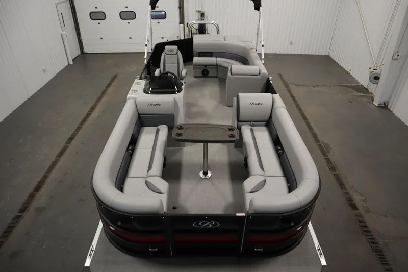 Slide: The Image of 2025 Bentley Pontoons 240 CRUISE in a garage, showcasing sleek design and modern features. - 4
