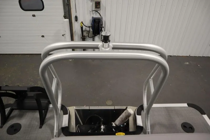 Slide: The Image of 2025 Bentley Pontoons 240 CRUISE boat ladder and deck in a garage setting. - 41