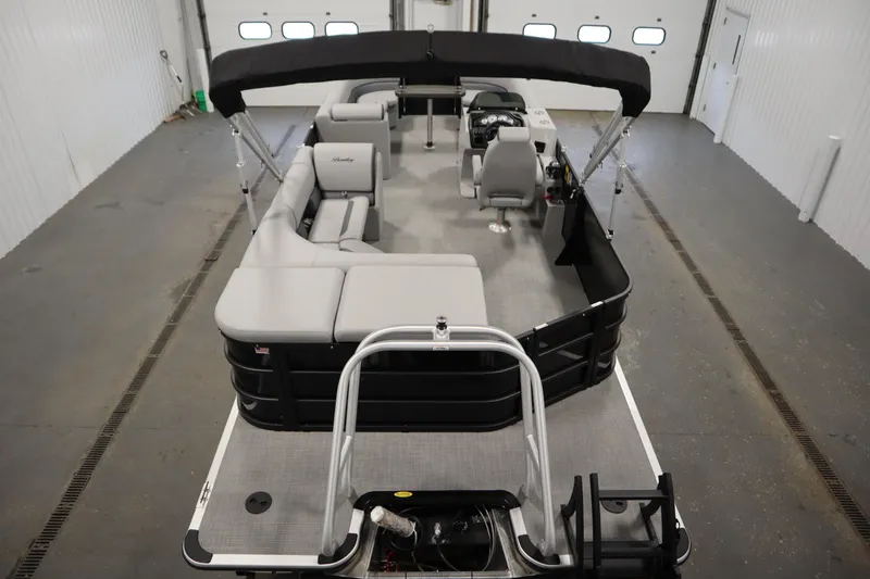 Slide: The Image of 2025 Bentley Pontoons 240 CRUISE in a showroom, showcasing sleek design and modern features. - 5