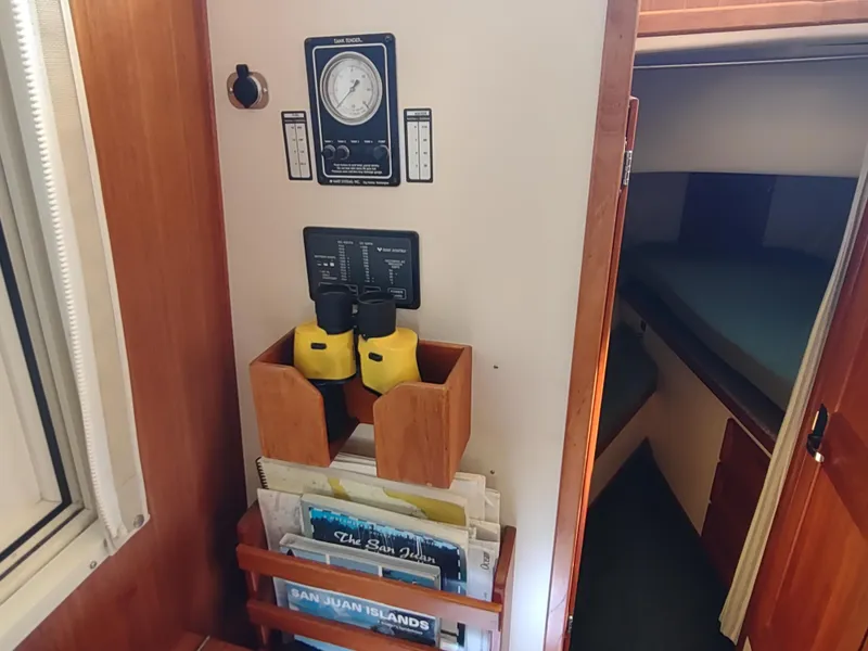 Slide: The Image of Interior of 2001 Nordic Tug 32 with navigation tools and storage. - 35