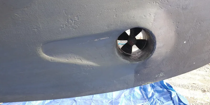 Slide: The Image of Close-up of a 2001 Nordic Tug 32 hull with a bow thruster. - 44