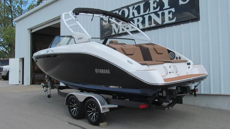 Slide: The Image of 2025 Yamaha Boats 222S on trailer outside Stokley's Marine. - 2