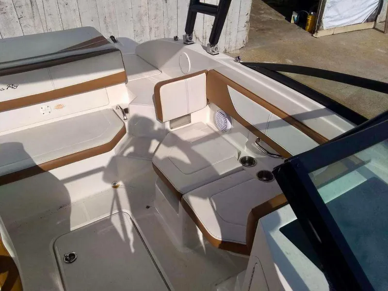 Slide: The Image of 2017 Sea Ray SPX 190 boat interior with white and brown seating. - 4