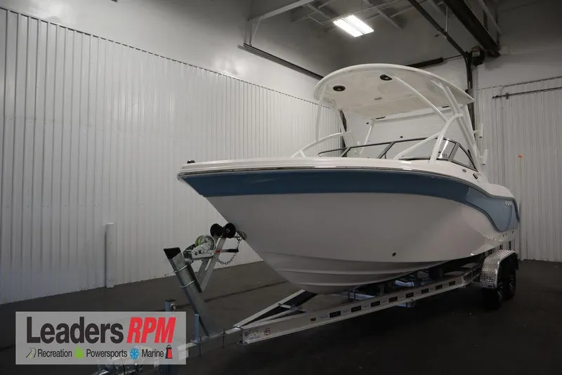 The Image of 2025 Sea Fox 228 Traveler boat on trailer in indoor showroom. - 1