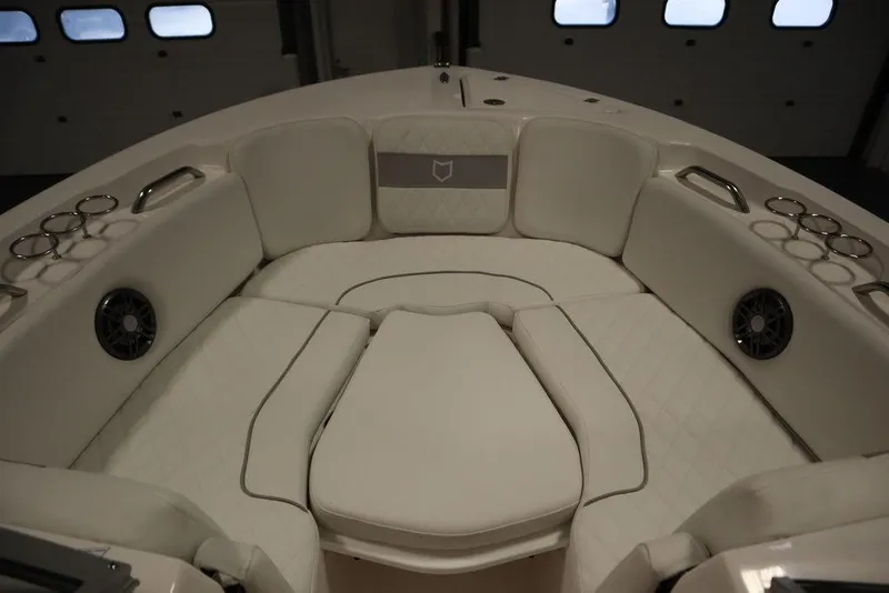 Slide: The Image of 2025 Sea Fox 228 Traveler boat interior with cushioned seating and cup holders. - 11
