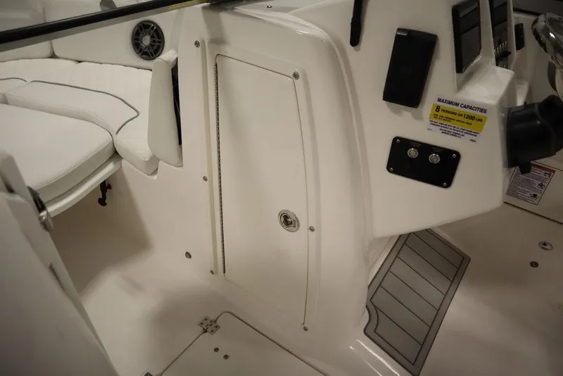 Slide: The Image of Interior view of 2025 Sea Fox 228 Traveler boat, featuring seating and control panel. - 14
