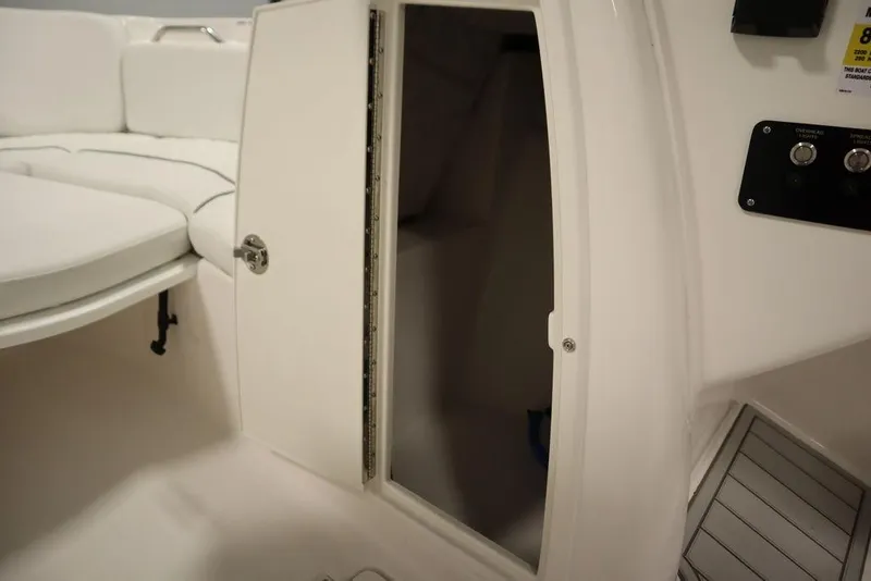 Slide: The Image of 2025 Sea Fox 228 Traveler boat interior with open storage compartment. - 16