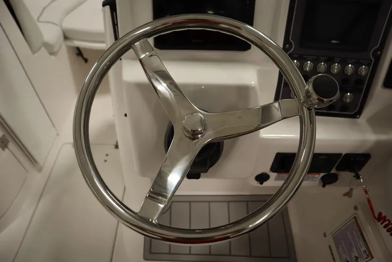 Slide: The Image of Steering wheel of 2025 Sea Fox 228 Traveler boat cockpit. - 18