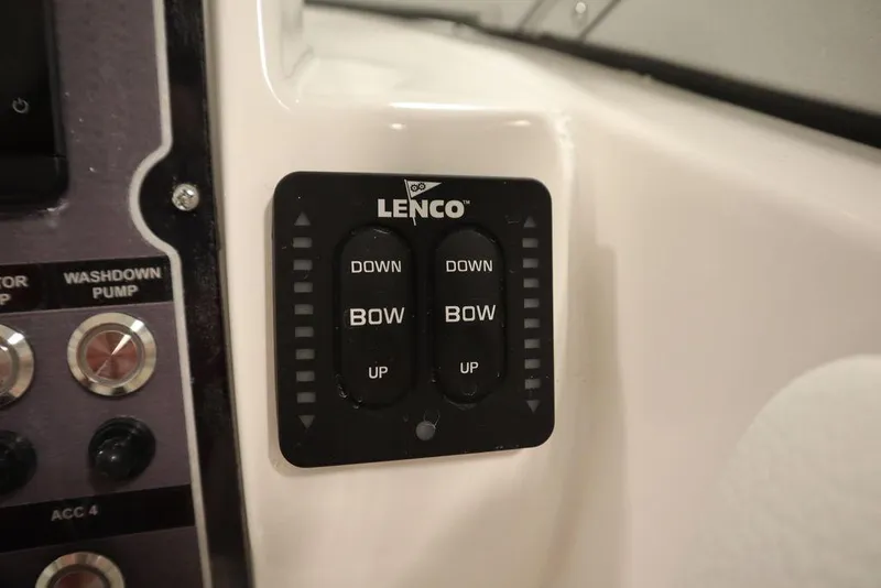 Slide: The Image of Lenco trim tab controls on 2025 Sea Fox 228 Traveler boat dashboard. - 21