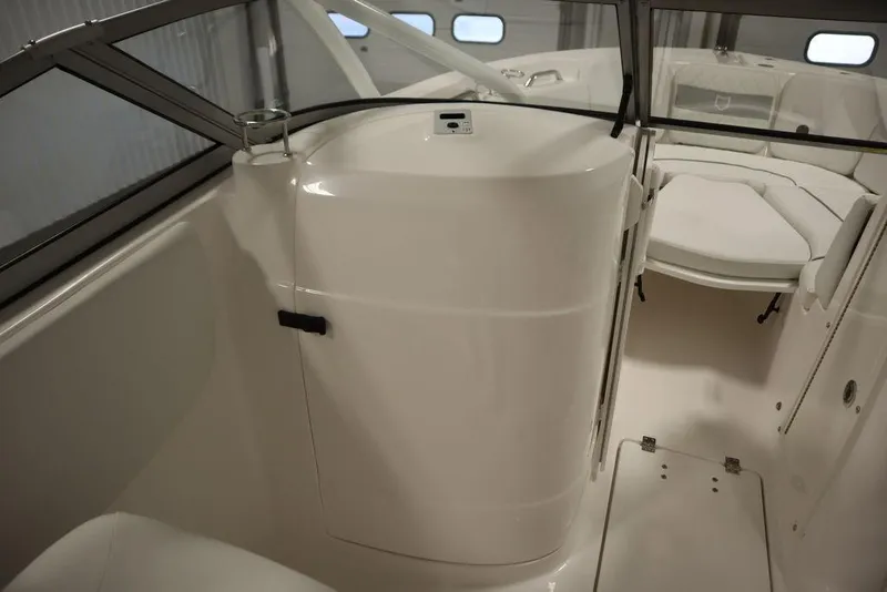Slide: The Image of Interior view of 2025 Sea Fox 228 Traveler boat, featuring sleek white design and seating area. - 26