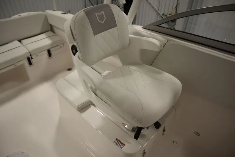Slide: The Image of 2025 Sea Fox 228 Traveler boat interior with white cushioned seating. - 28