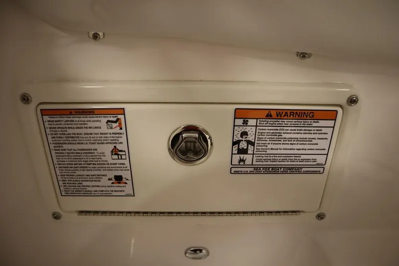 Slide: The Image of Warning labels on 2025 Sea Fox 228 Traveler boat panel. - 33
