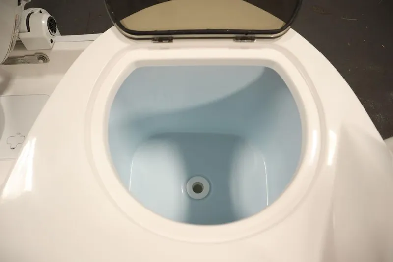 Slide: The Image of 2025 Sea Fox 228 Traveler boat livewell, open lid, white and blue interior. - 42