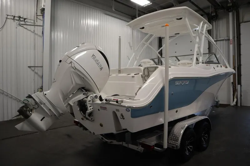 Slide: The Image of 2025 Sea Fox 228 Traveler boat with Yamaha engine in a garage. - 5