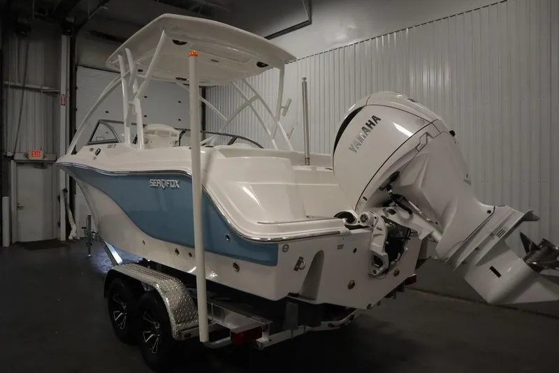 Slide: The Image of 2025 Sea Fox 228 Traveler boat with Yamaha engine in indoor storage. - 8