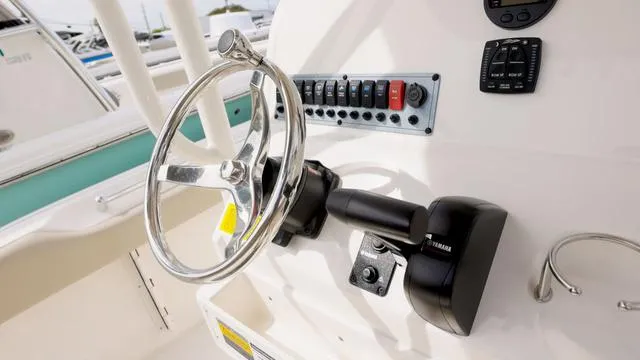 Slide: The Image of 2024 Key West 219 FS boat steering wheel and control panel. - 3