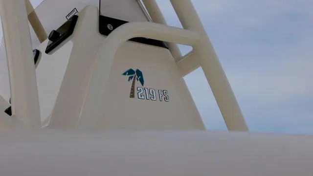 Slide: The Image of 2024 Key West 219 FS boat logo with palm tree design. - 4