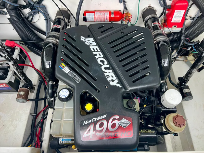 Slide: The Image of 2005 Baja Outlaw engine compartment with Mercury MerCruiser 496 motor and fire extinguisher. - 25