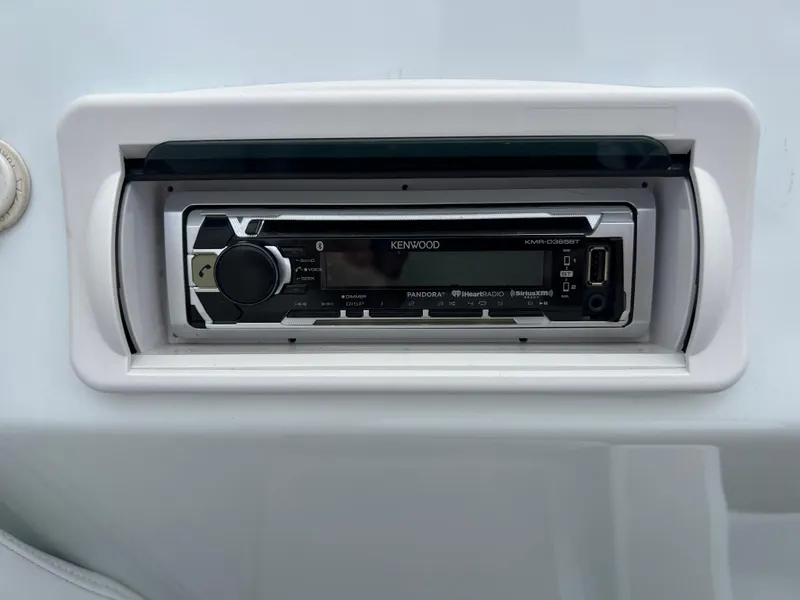 Slide: The Image of Kenwood stereo system in a 2005 Baja Outlaw boat dashboard. - 29