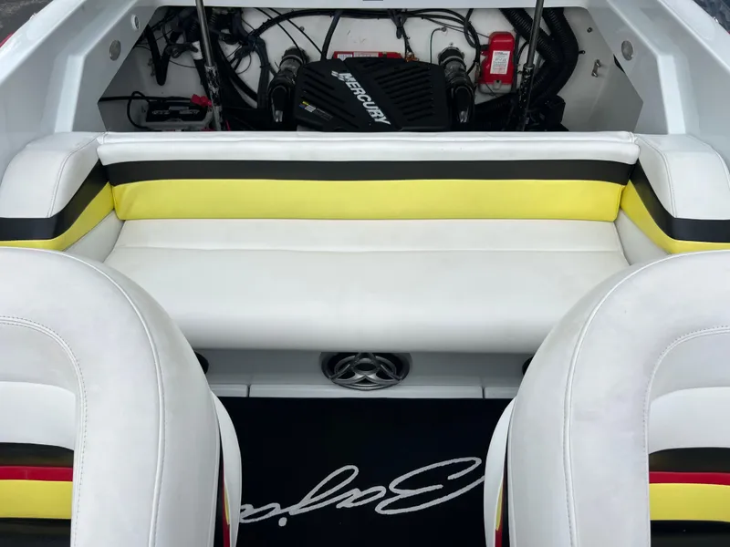 Slide: The Image of Interior of a 2005 Baja Outlaw boat with yellow and black seating. - 31