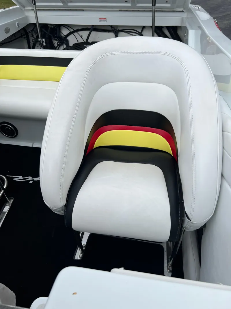 Slide: The Image of White and multicolored seat in a 2005 Baja Outlaw boat. - 32