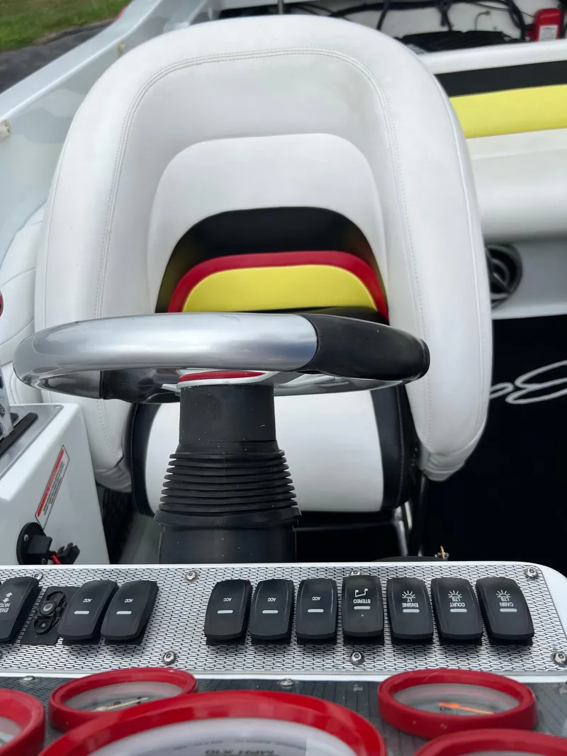 Slide: The Image of 2005 Baja Outlaw boat interior with steering wheel and control panel. - 33