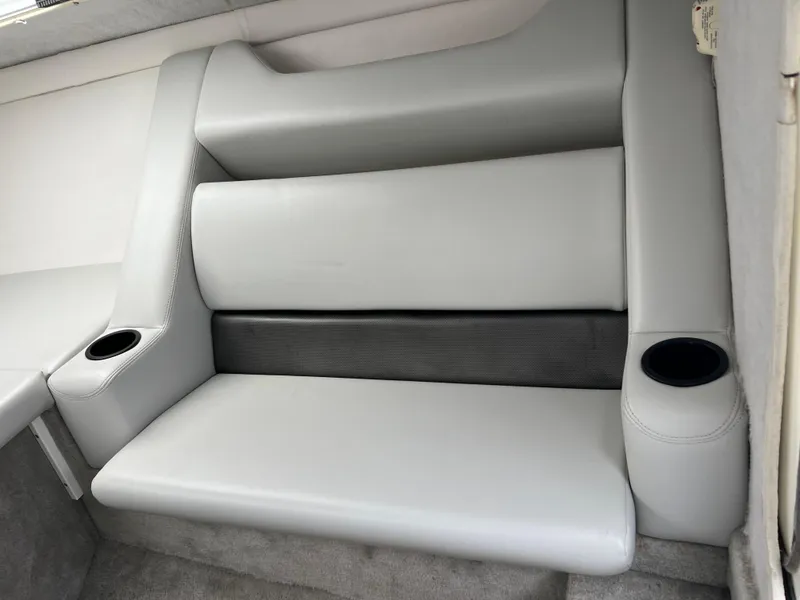 Slide: The Image of 2005 Baja Outlaw boat interior with gray seating and cup holders. - 39
