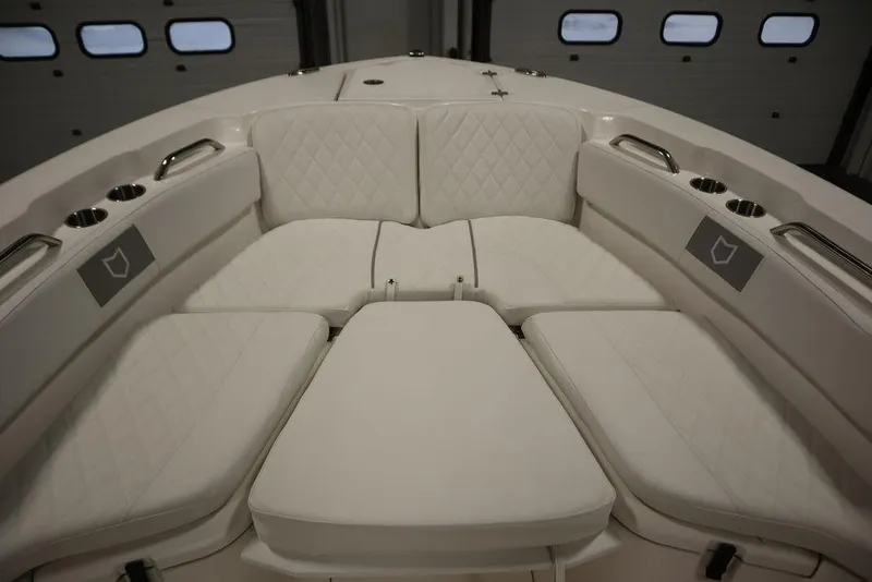 Slide: The Image of 2025 Sea Fox 228 Commander boat with luxurious white seating and cup holders. - 11
