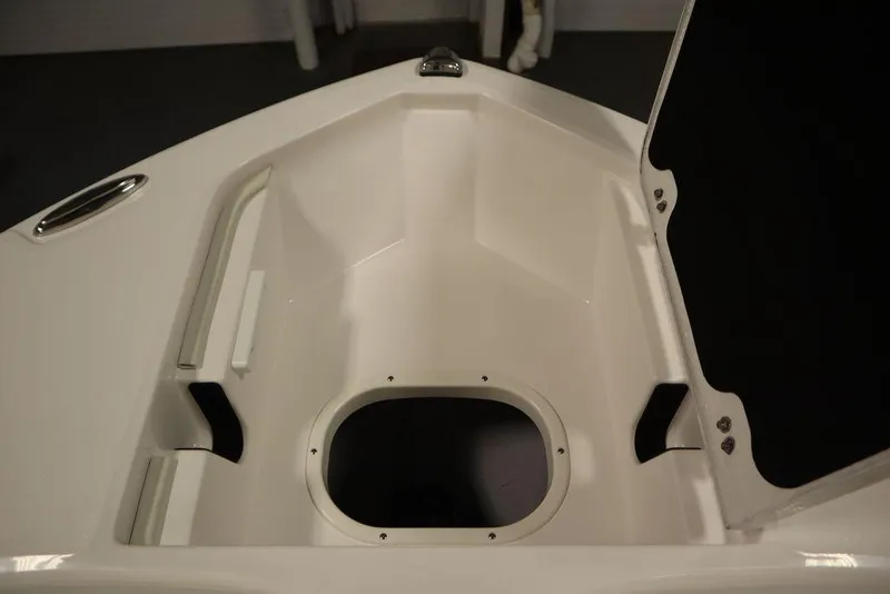 Slide: The Image of 2025 Sea Fox 228 Commander boat storage compartment, open and empty. - 13