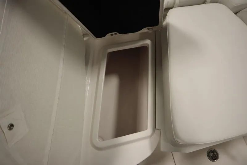 Slide: The Image of 2025 Sea Fox 228 Commander storage compartment with cushioned seating. - 14