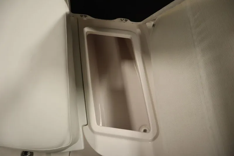 Slide: The Image of 2025 Sea Fox 228 Commander boat storage compartment, open and empty. - 15