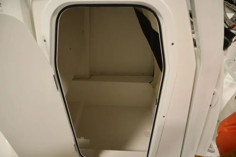 Slide: The Image of 2025 Sea Fox 228 Commander interior cabin space, open door view. - 22