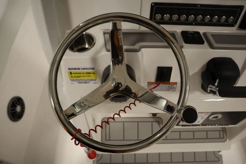 Slide: The Image of Steering wheel of 2025 Sea Fox 228 Commander boat with control panel. - 24