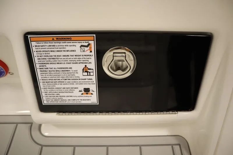 Slide: The Image of 2025 Sea Fox 228 Commander boat warning label and latch detail. - 29
