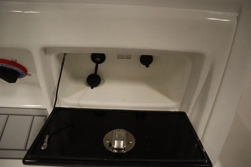 Slide: The Image of 2025 Sea Fox 228 Commander boat console storage compartment. - 30