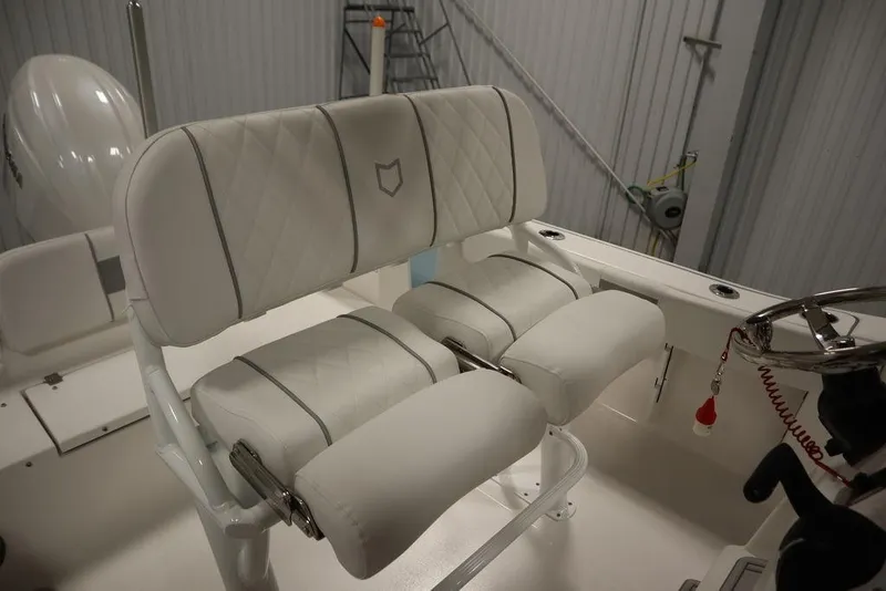 Slide: The Image of 2025 Sea Fox 228 Commander boat interior with white cushioned seating. - 31